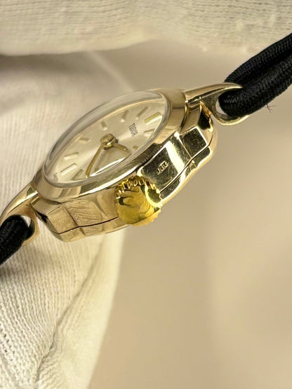 Side profile of Tudor 1957 ladies vintage timekeeper with slim 9ct gold case styling, hallmarked case