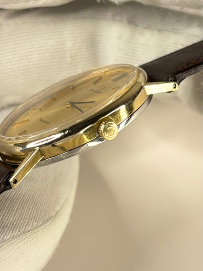 Side profile of Omega Genève Ref. 511.416 unisex vintage dress timekeeper with slim 1972 gold plated case styling omega signed crown