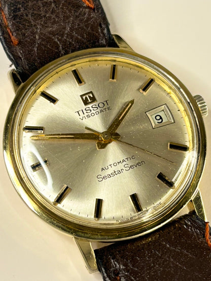 Collectible Tissot Visodate 1972 men’s vintage timekeeper featuring white sunburst dial and automatic calibre