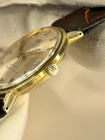 Side profile of Tissot Visodate 1972 men’s vintage dress timekeeper with slim gold plated case styling Tissot signed crown