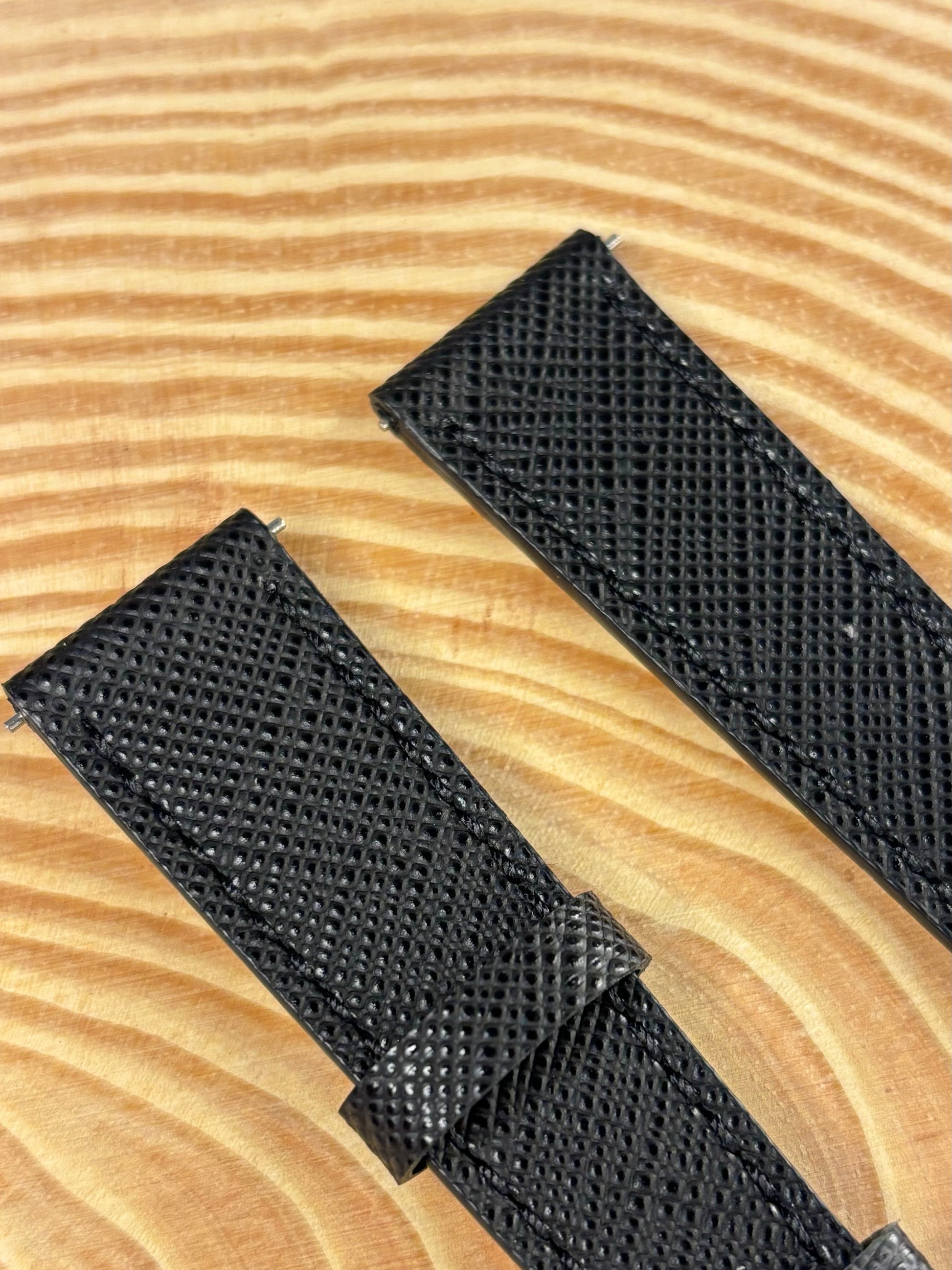 Premium handmade luxury black Saffiano leather watch strap showing structured crosshatch texture