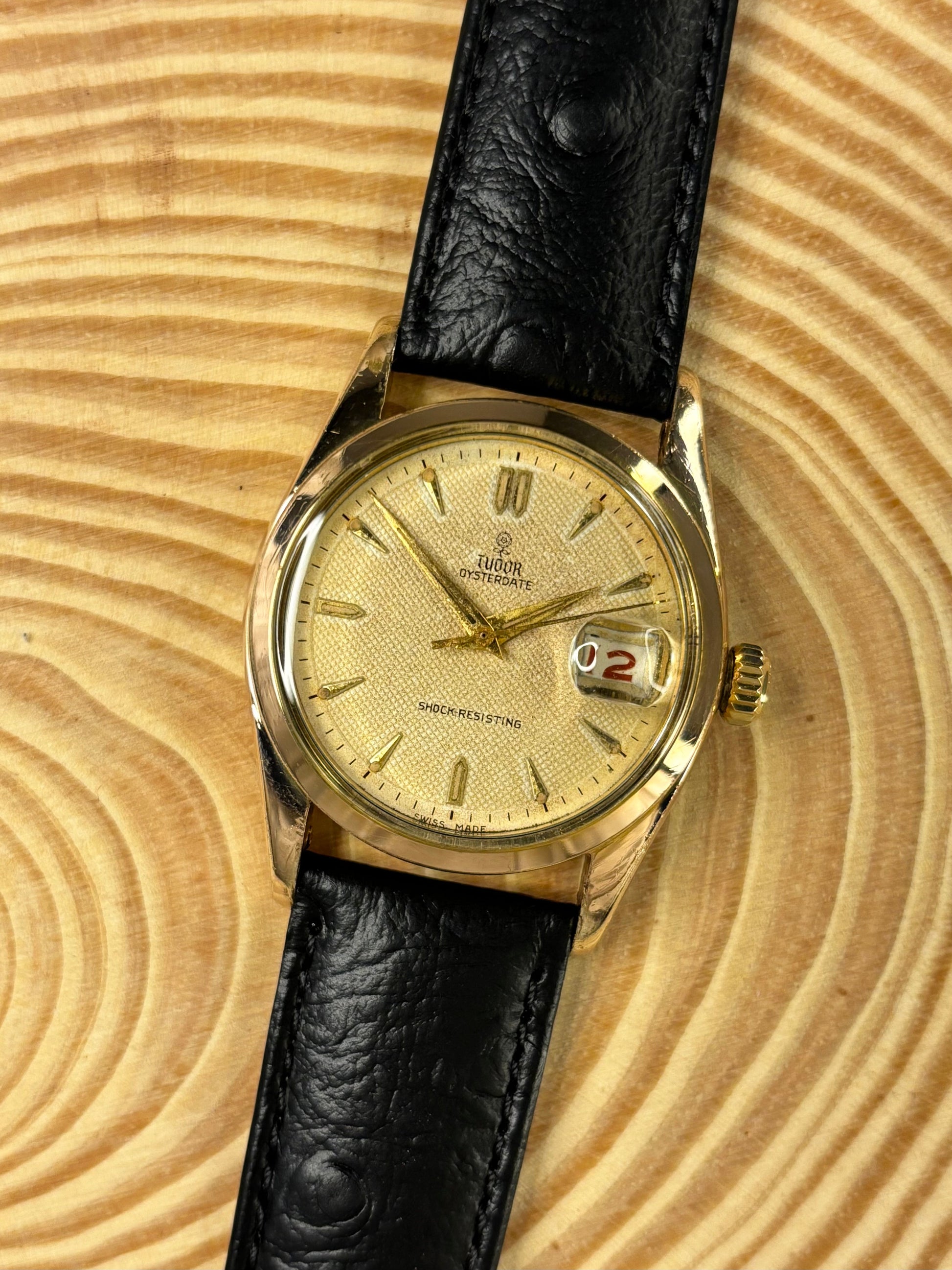 Handmade premium luxury ostrich grain leather watch strap highlighting unique natural texture seen on a vintage Tudor Oysterdate dress watch