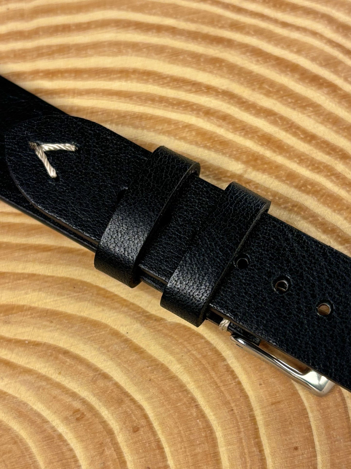 Premium handmade luxury black Italian calf leather watch strap showing refined aged patina