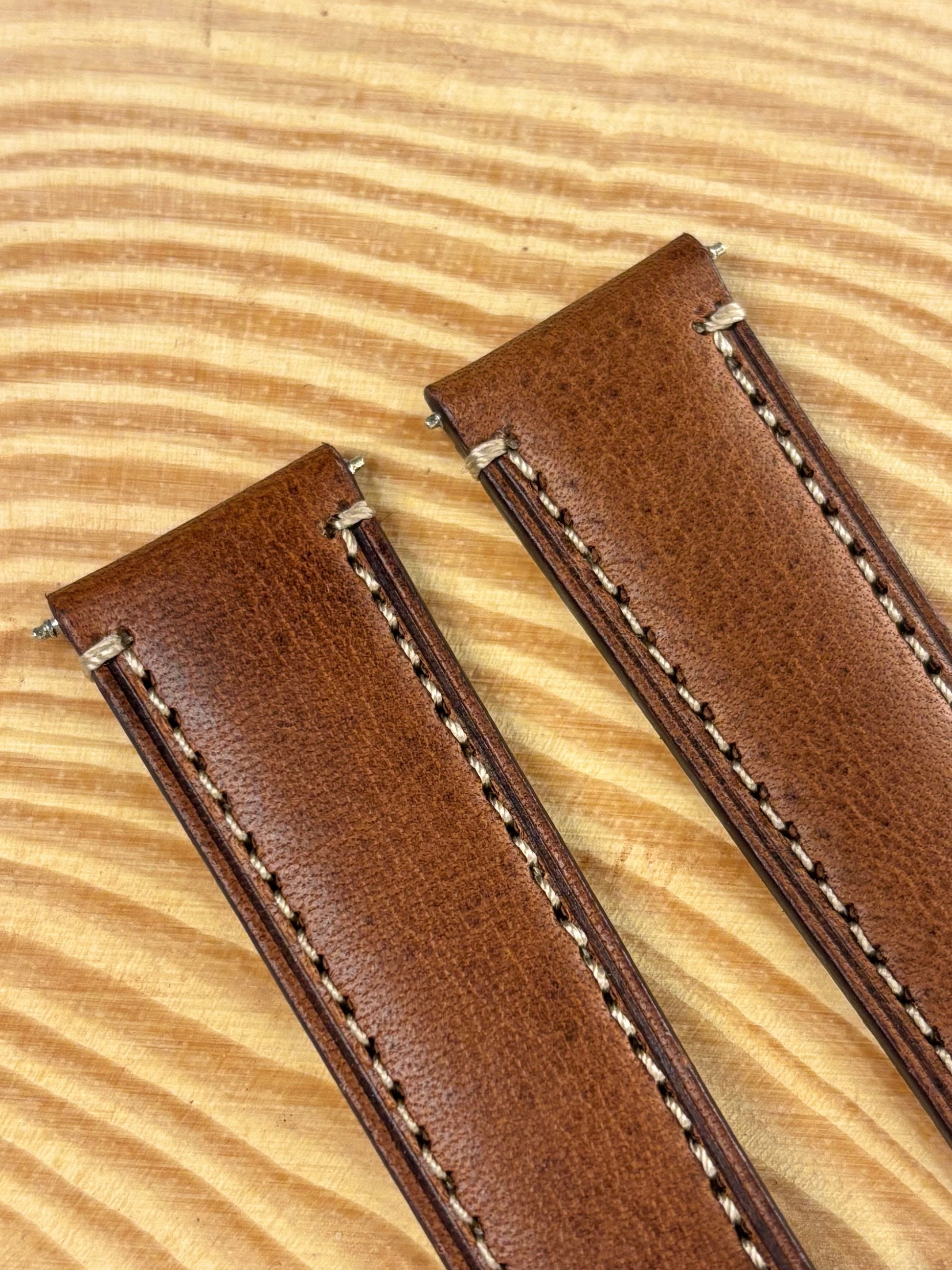 Premium handmade luxury brown Italian calf leather watch strap showing refined contrast stitching