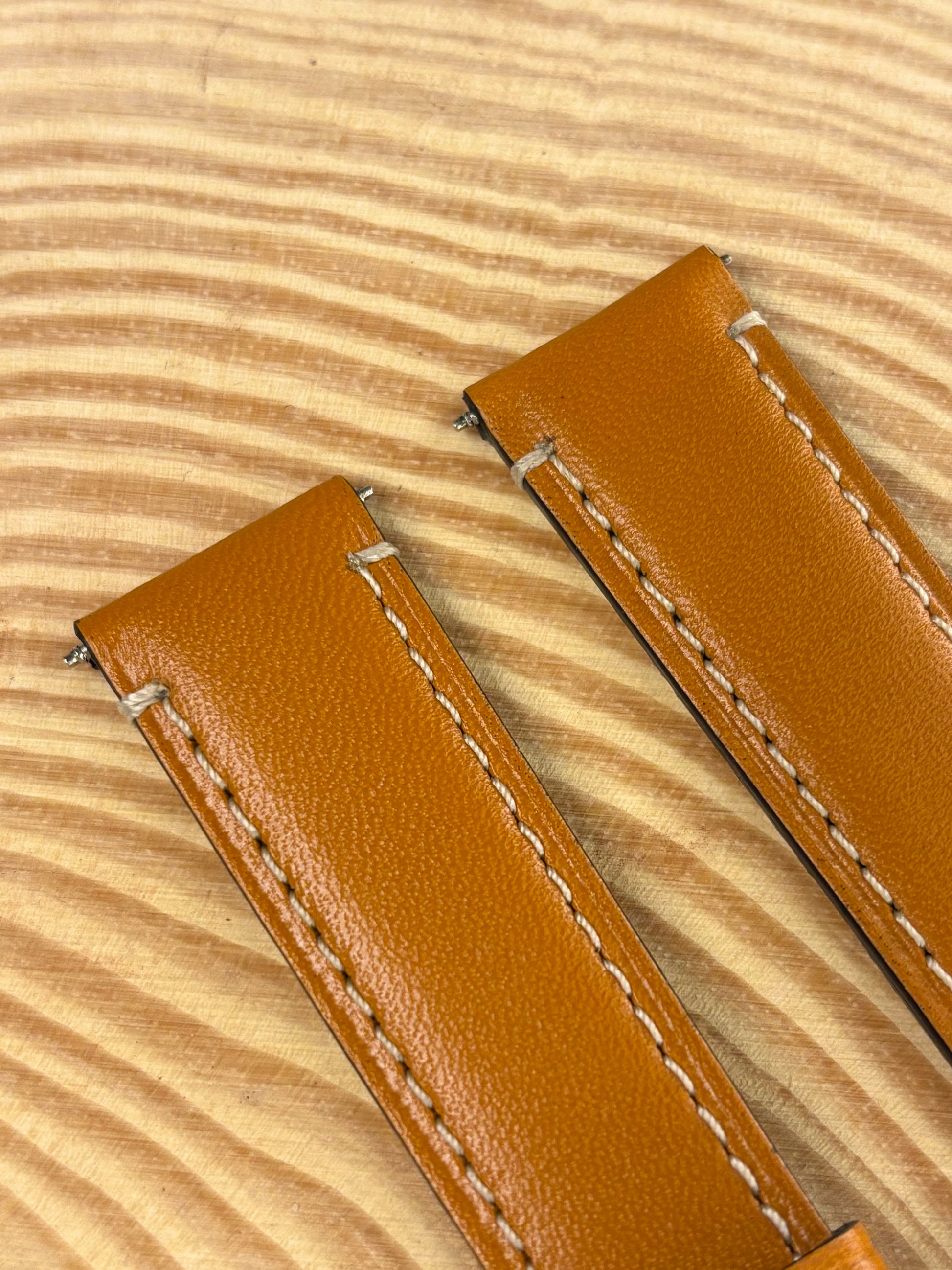 Premium handmade luxury light brown Italian calf leather watch strap showing refined contrast stitching