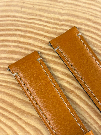Premium handmade luxury light brown Italian calf leather watch strap showing refined contrast stitching